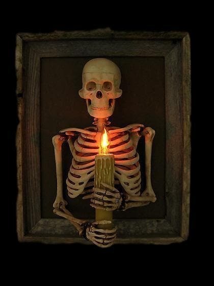 Halloween's Framed Skeleton Torso Wall Decor with Flashing Candle Light