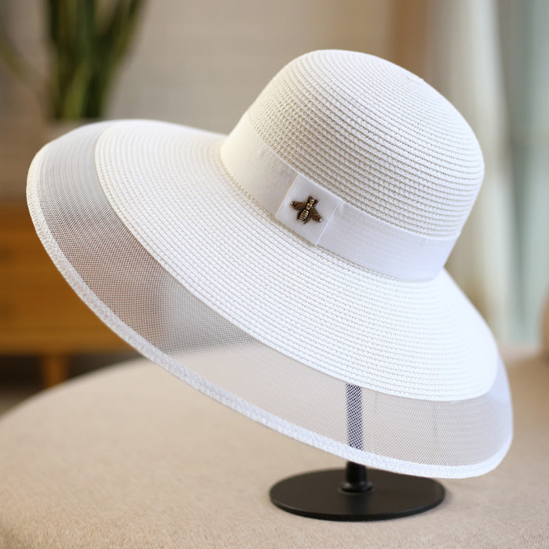 Stilfuld dame-solhat til UV-beskyttelse og sommermode