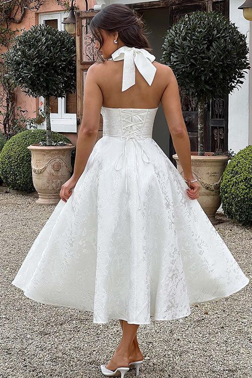 Dame maxi-kjole i jacquard med V-udskæring, halterneck og ærmeløs design