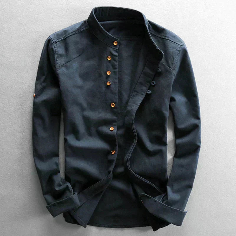 Black button-up shirt on a light gray background