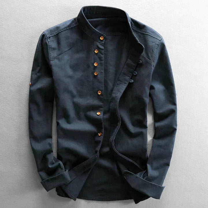 Black button-up shirt on a light gray background