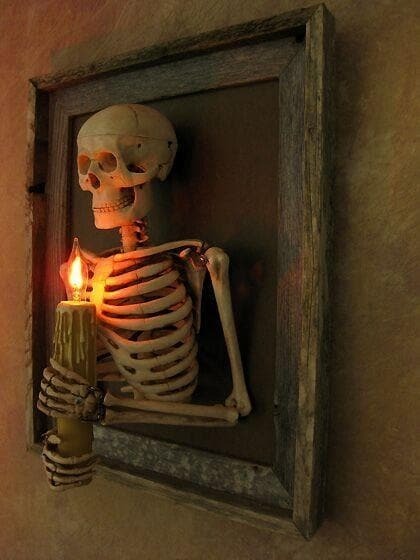 Halloween's Framed Skeleton Torso Wall Decor with Flashing Candle Light
