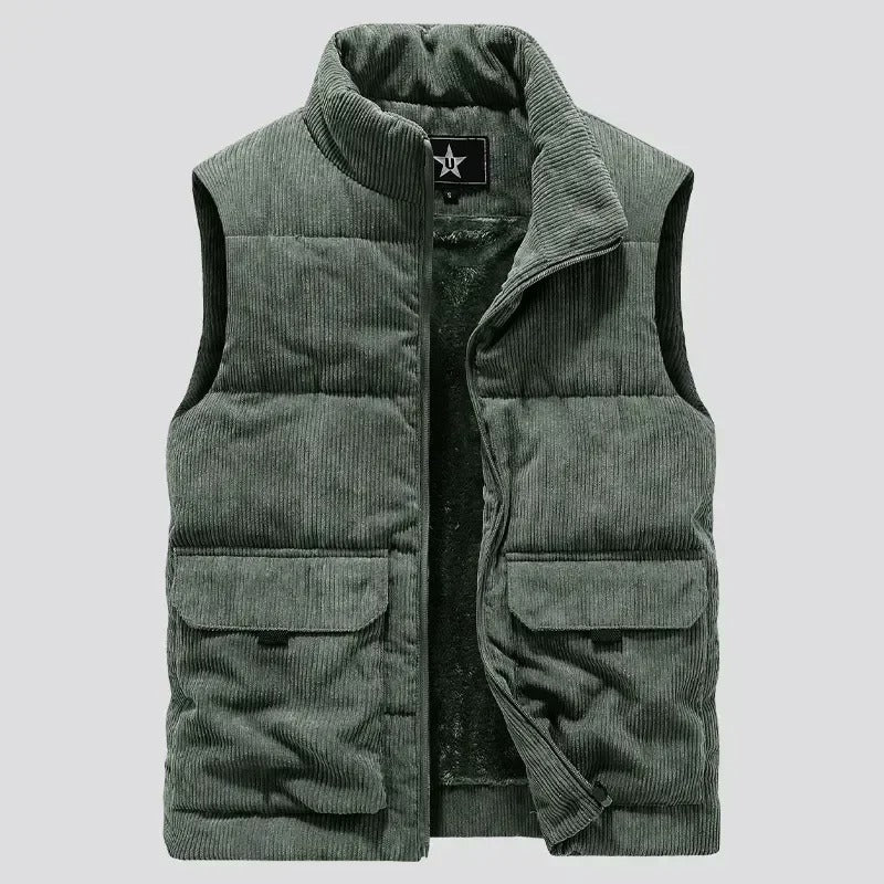 Green corduroy vest with a brand logo on a light gray background