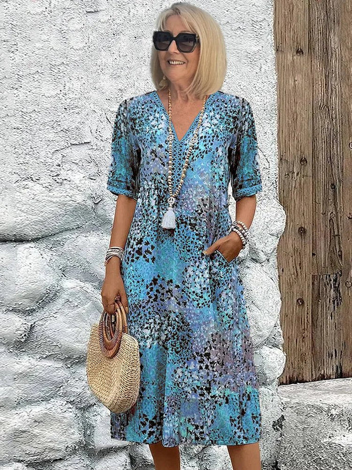 Emily | Damen Midi-Kleid in Übergröße mit V-Ausschnitt, Blumenmuster und Taschen